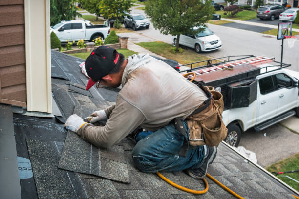 Professional Roofing technician working in East Hampton, NY